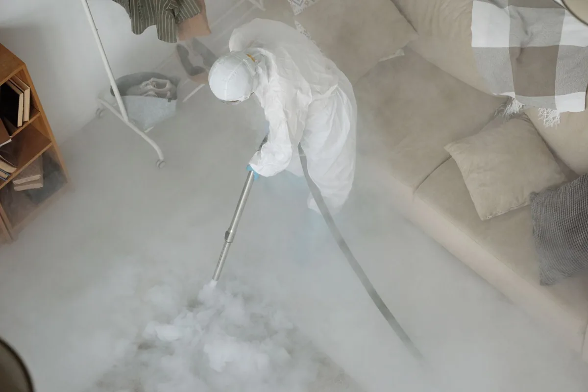 Biohazard cleanup technician in protective equipment, Thunderbolt, GA